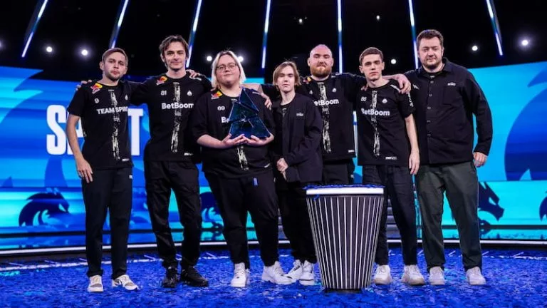 Photo taken of Team Spirit holding the trophy of BLAST Bounty 2025 Season 1.