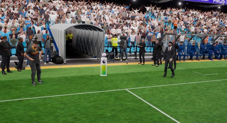 Screenshot taken from FM26, featuring two coaches.