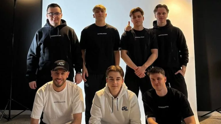 The entire GamerLegion CS2 team, including players and coaches.