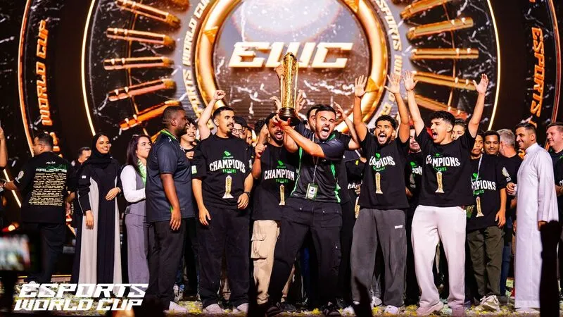 Team Falcons lifting the EWC Club Champioship trophy