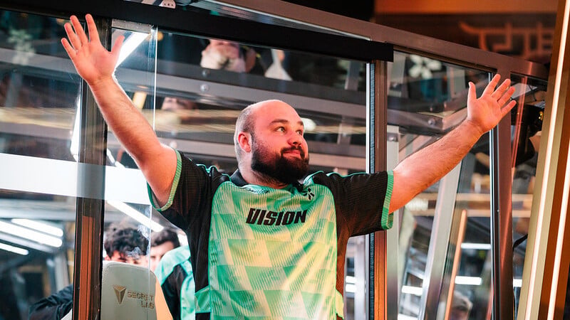 an image of No[o]ne from TEAM VISION holding his hands up